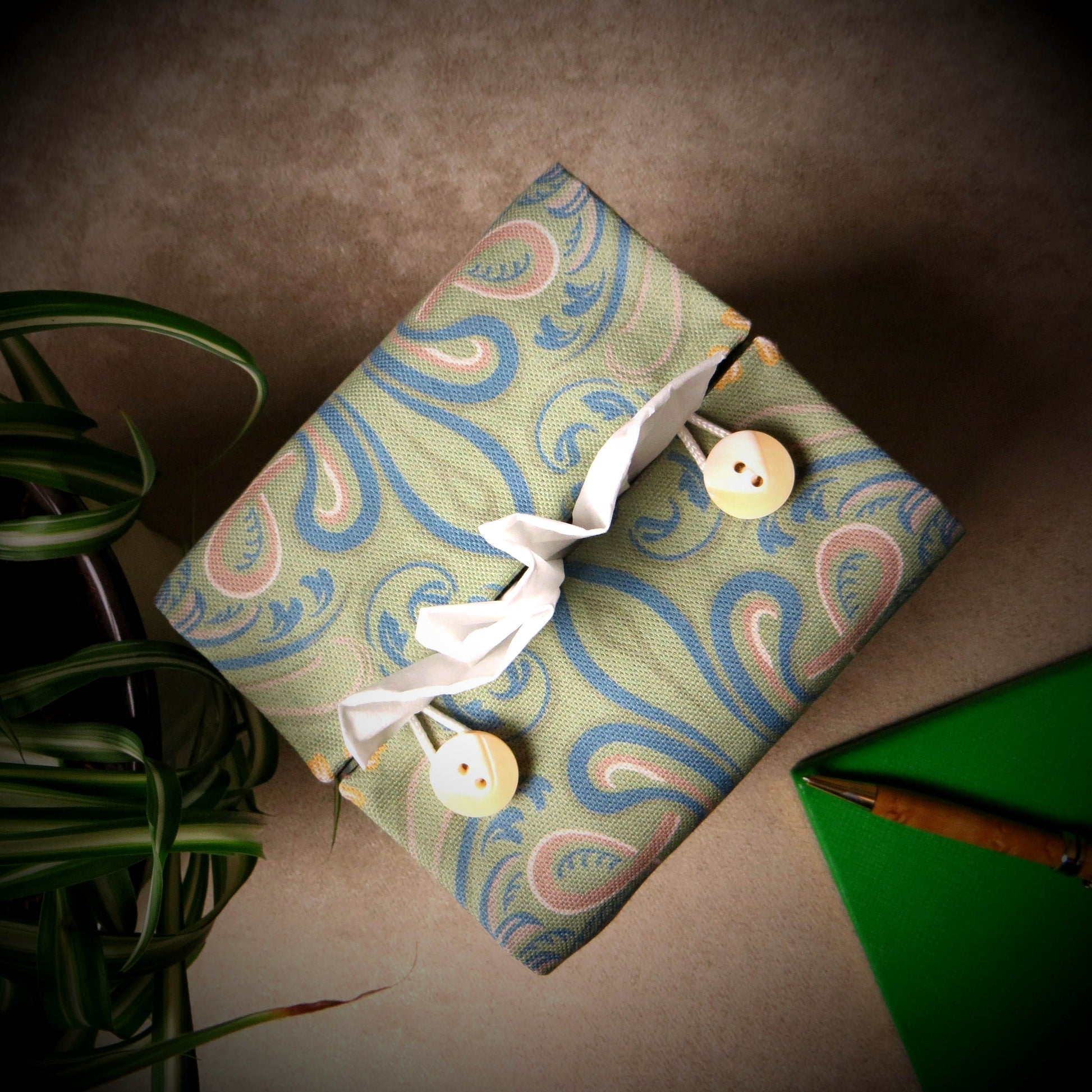 Square tissue box cover with yellow flowers and blue Victorian embellishment on sage green background