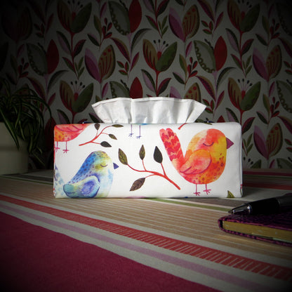 Cotton rectangle tissue box cover with watercolour style blue, purple, and orange sleeping birds on white background