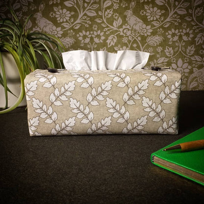 Printed cotton rectangle tissue box cover with off-white ash leaf pattern on oatmeal colour background