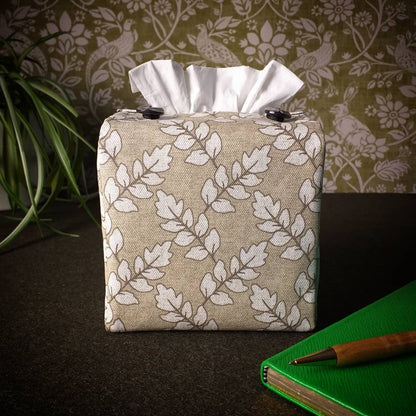 Square tissue box cover with off-white ash leaf pattern on oatmeal colour background