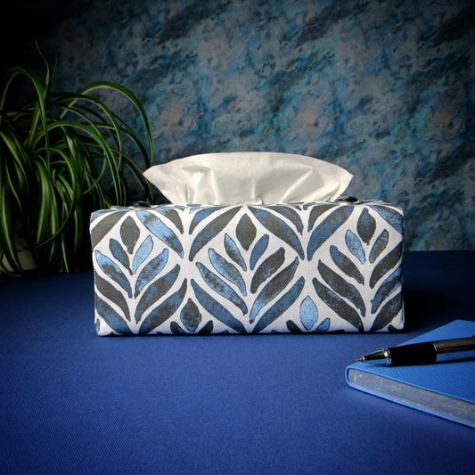 Rectangle tissue box cover with navy blue watercolour style leaf pattern on white background