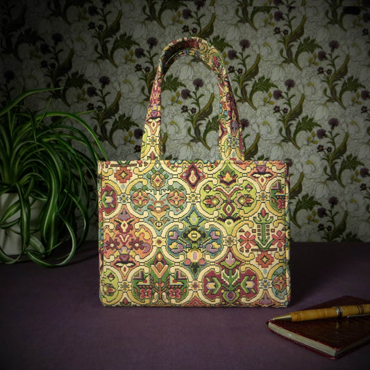 Mini tote bag with multi colour geometric pattern and purple velvet lining