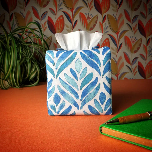 Square tissue box cover with blue watercolour style leaf pattern on white background