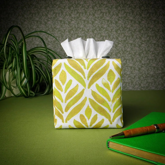 Square tissue box cover with yellow watercolour style leaf pattern on white background