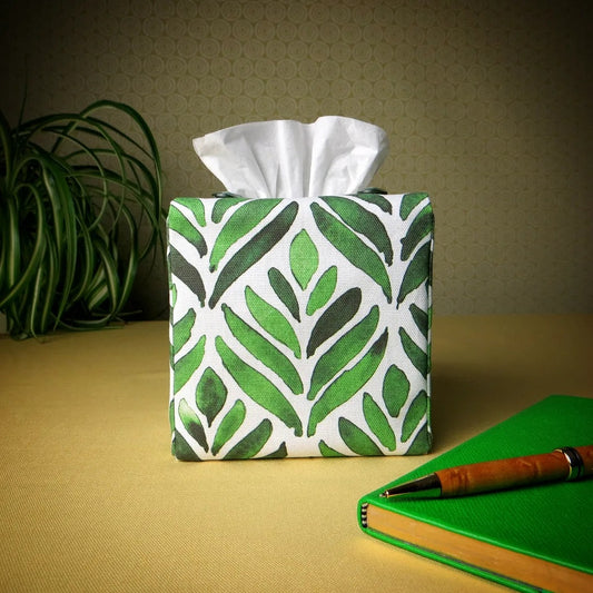 Square tissue box cover with green watercolour style leaf pattern on white background