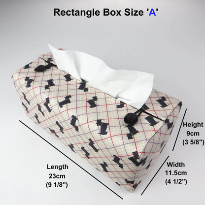 Rectangle tissue box cover with iconic black Scottish Terrier dogs with metallic gold collar design on beige background with red, purple, and white grid