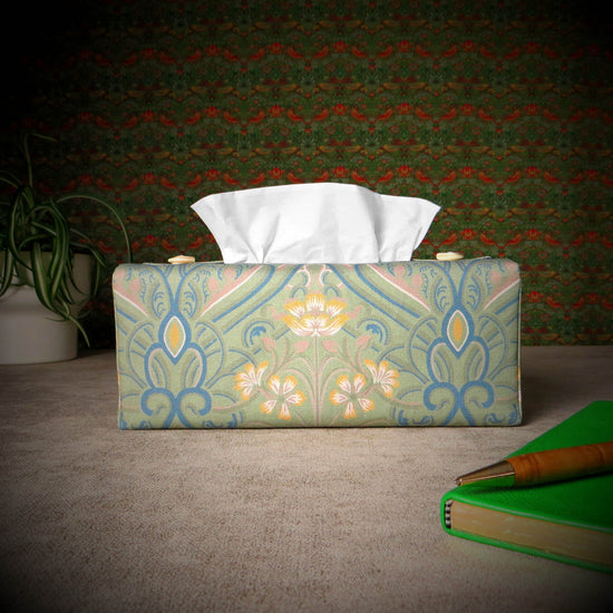 Rectangular tissue box cover with yellow flowers and blue Victorian embellishment on sage green background