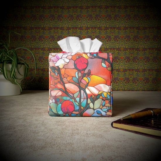 Square tissue box cover with floral garden stained glass design on red toned background